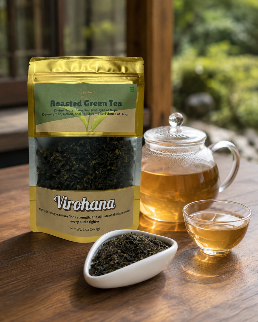 Virohana Roasted Green Tea package with tea leaves, teapot, and cup on a wooden table.