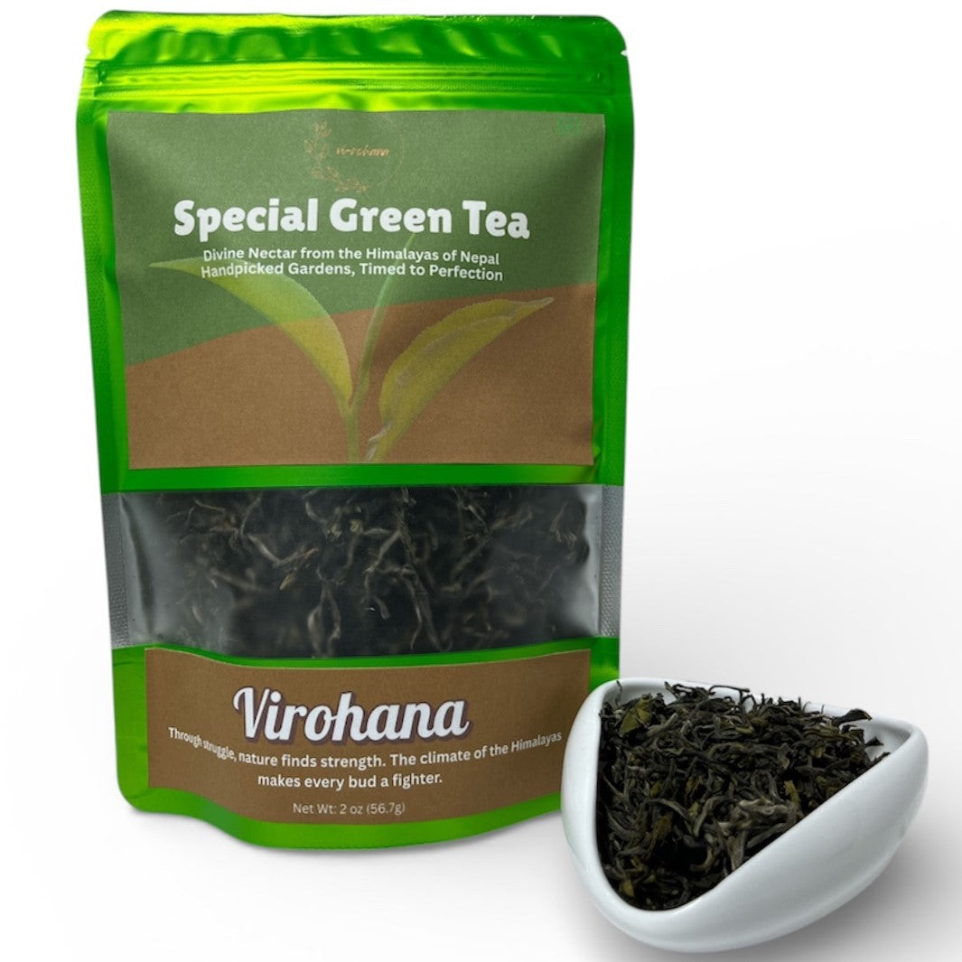 Virohana Special Green Tea package with tea leaves in a white dish on a white background