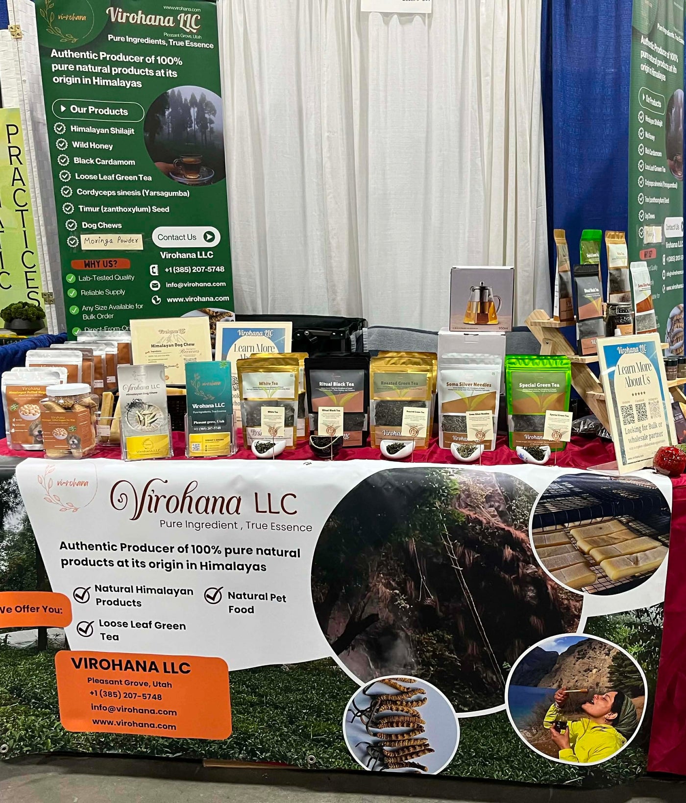 Virohana LLC booth with products and branding at an event